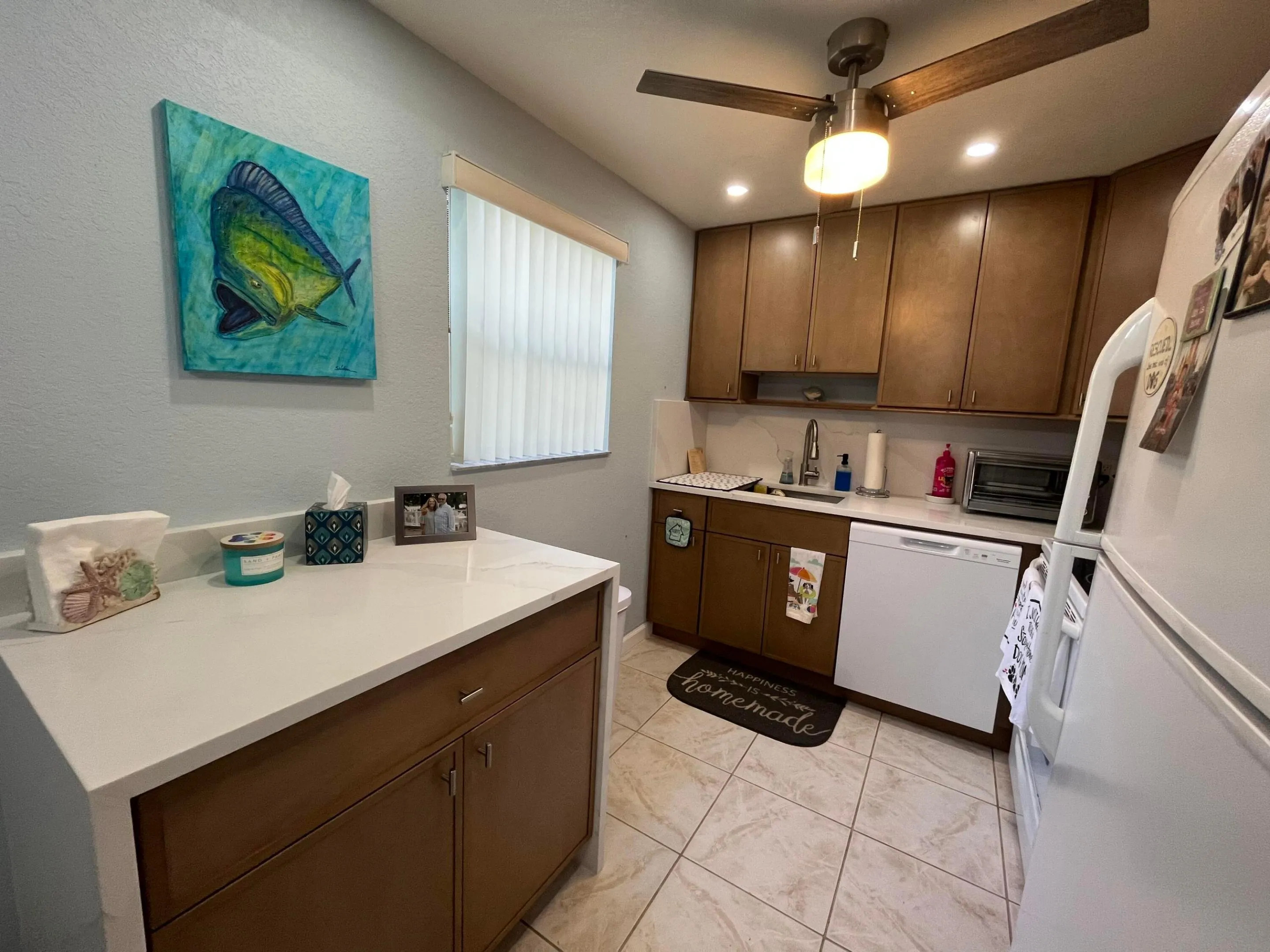 kitchen with additional waterfall quartz top on storage