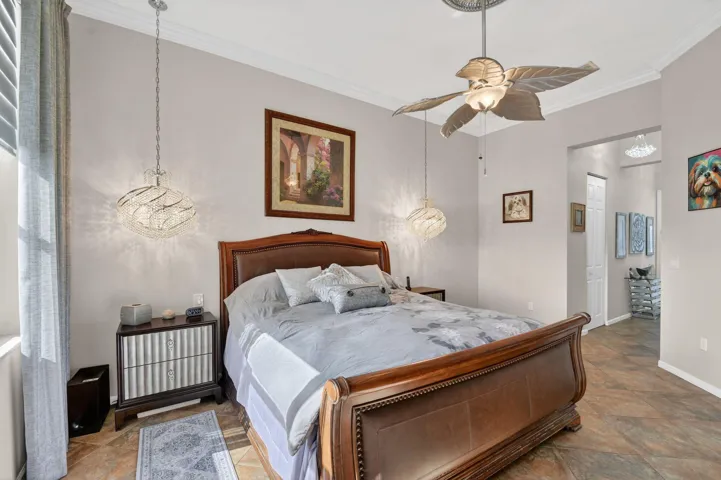 Beautiful lighting in Primary Room and there are Dual Closets with interior appointed by Closet Factory