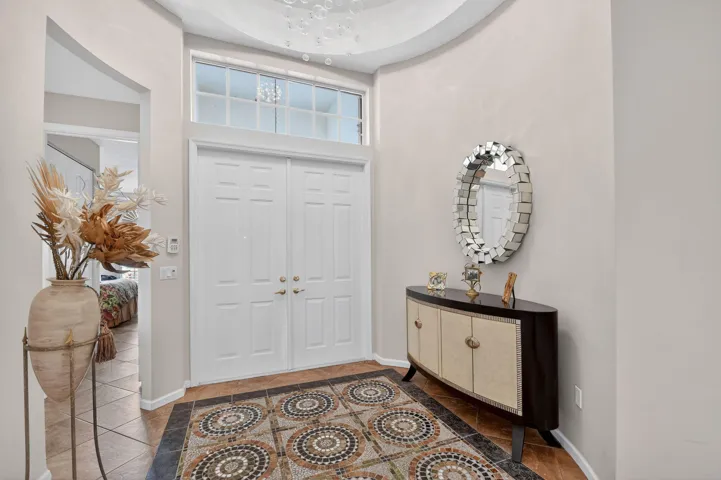 Entry Foyers features not only 12 Ft Ceilings but Mosaic Tile