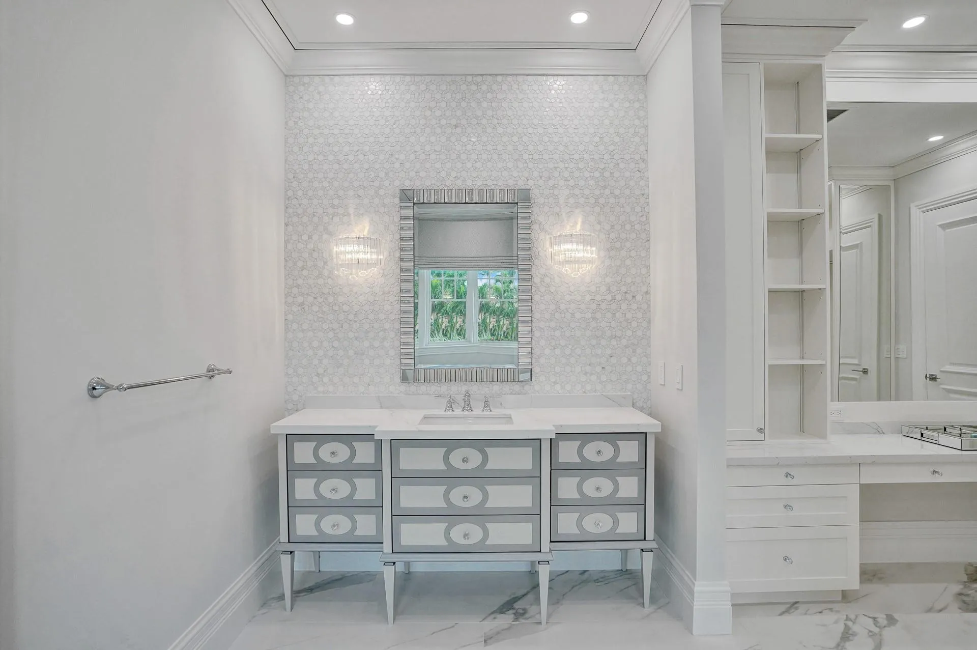 The primary suite boasts separate his-and-hers bathrooms; her bathroom features a spa-like soaking tub, makeup vanity, and a spacious walk-in closet.