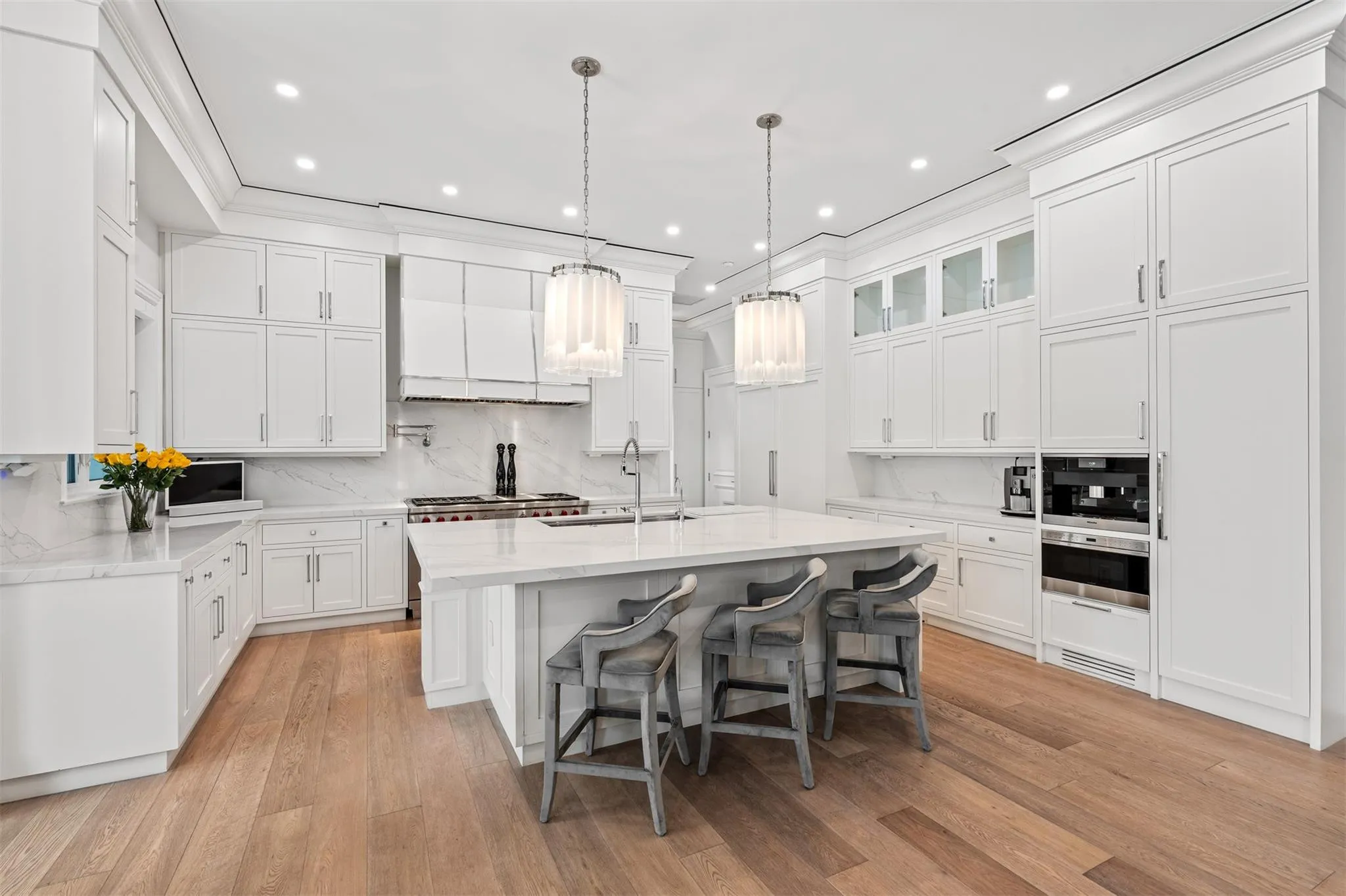 A chef's dream! Equipped with Sub-Zero and Wolf appliances. Overlook your main living space while eating and cooking.
