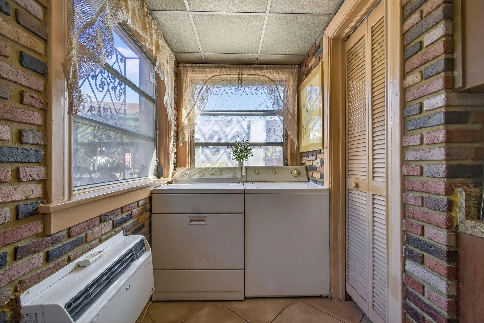 the louver doors lead to pantry - could be converted to half bath or cabana bath