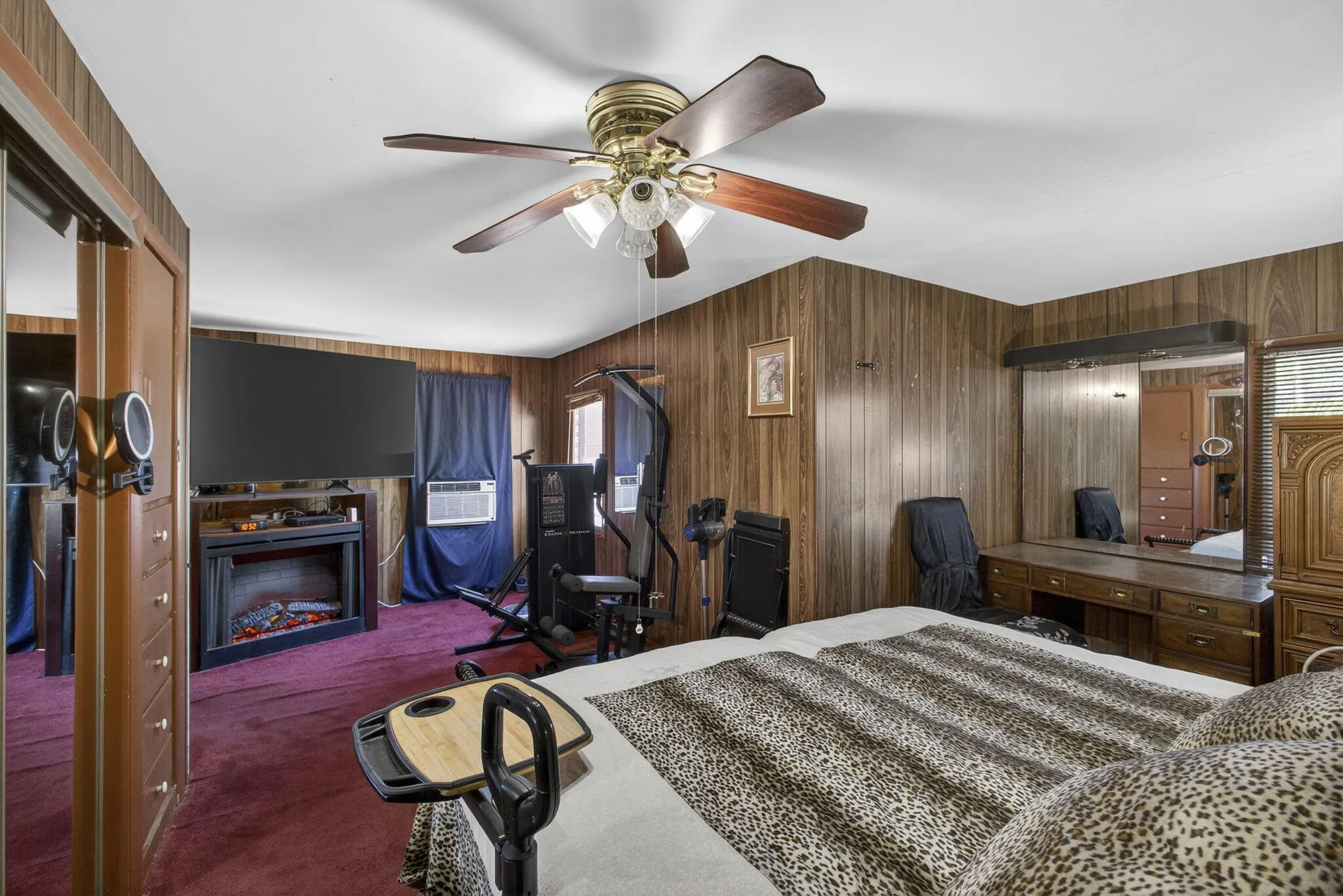 This room features a large built in "murphy bed" style custom built headboard. This could be removed for additional space in an already spacious room!