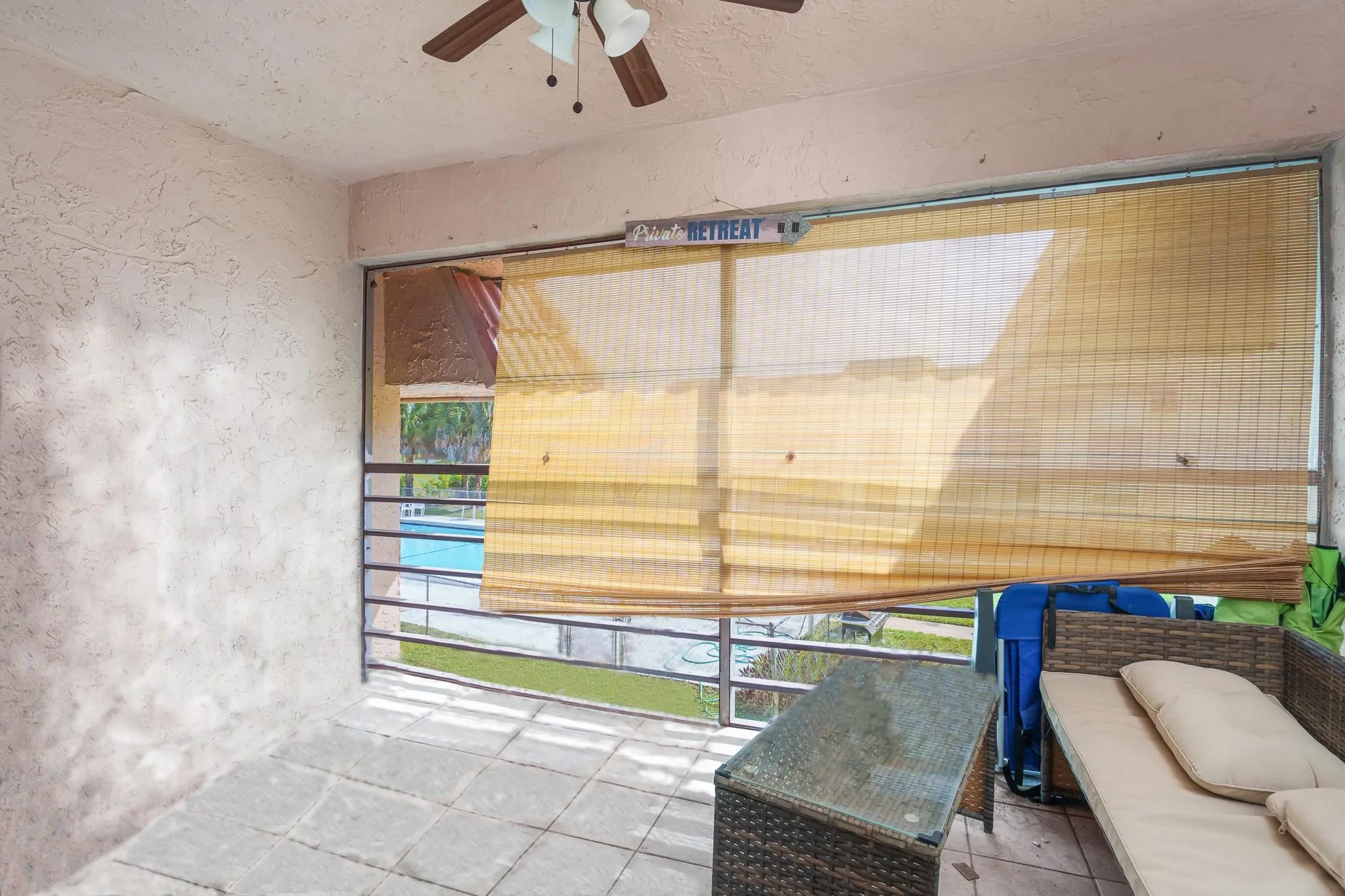 Screened-in balcony overlooks the pool