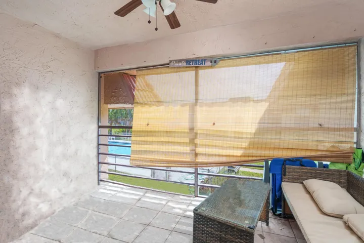 Screened-in balcony overlooks the pool
