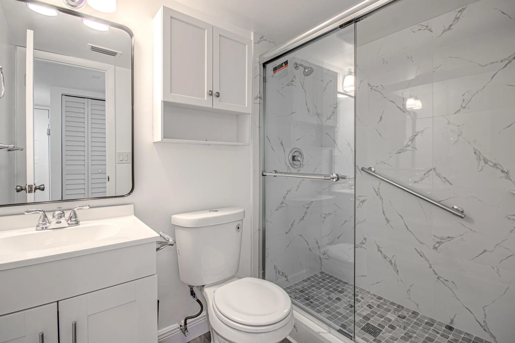Second Bathroom Shower and floors completely Redone with Modern Tiles, light fixtures mirror.