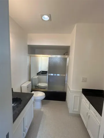 Master Bathroom - Shower / Bathtub combo - new toilet and lighting fixtures, newly painted.