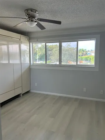 2nd Bedroom or Guest Bedroom - comes with a Murphy bed already installed to save space - can be an office space as well. Huge closet spaces - including on both sides of the Murphy bed! overlooks a walk way and parking lot. Condo has views of both the east and the west so you can catch both the sunrise and the sunsets! New flooring just installed.