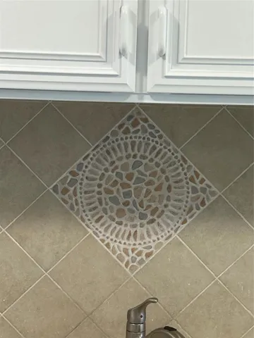 Custom backsplash over kitchen sinks.