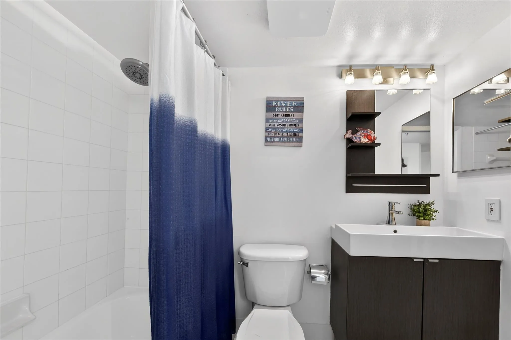 Modern bathroom features upgraded vanity, sleek fixtures, and clean contemporary finishes for a fresh, updated feel.
