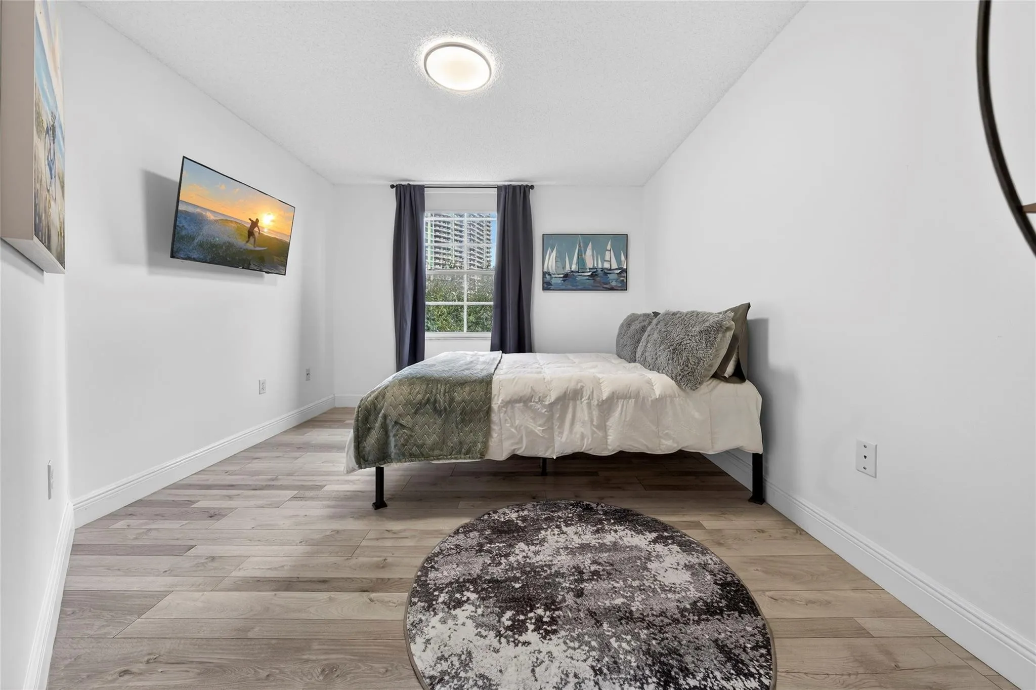 Spacious secondary bedroom easily accommodates a king-size bed and full furnishings, complete with a walk-in closet and en-suite bathroom for added comfort and privacy.