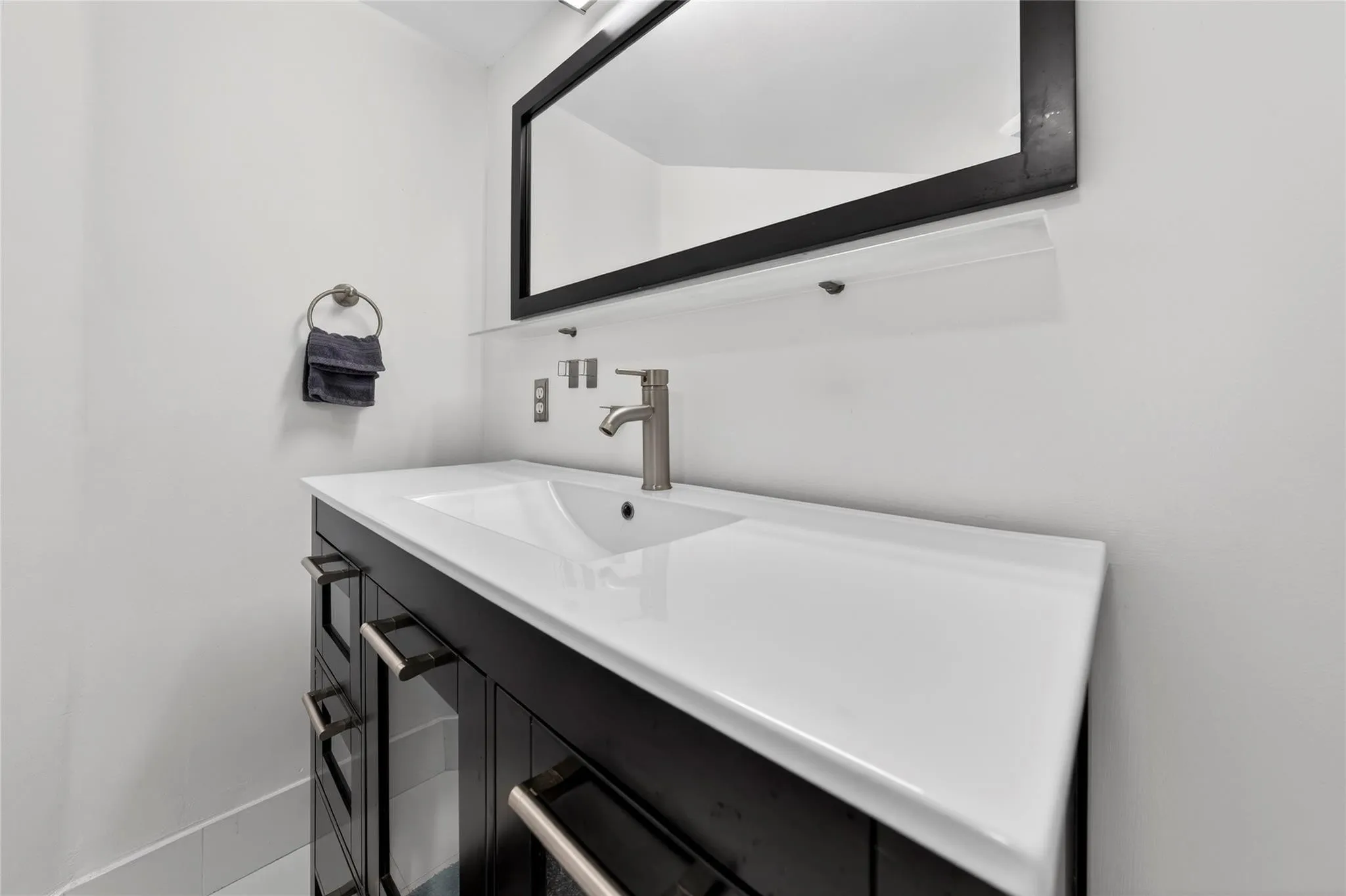 Modern bathroom features upgraded vanity, sleek fixtures, and clean contemporary finishes for a fresh, updated feel.