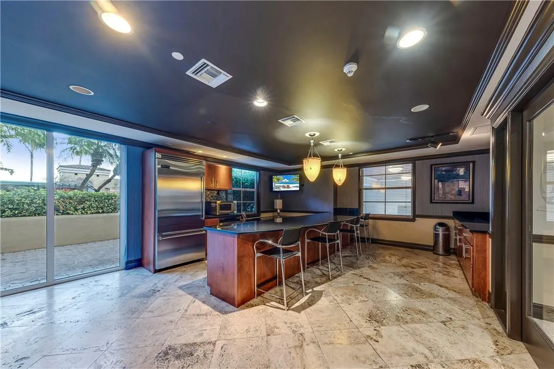 Co-working space and kitchen perfect for entertaining, whether you're hosting a party or enjoying family time by the pool.