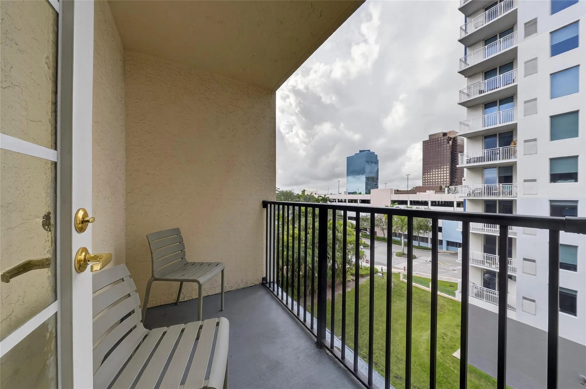Private patio off the primary bedroom offers treetop views and a quiet outdoor space to relax and unwind.
