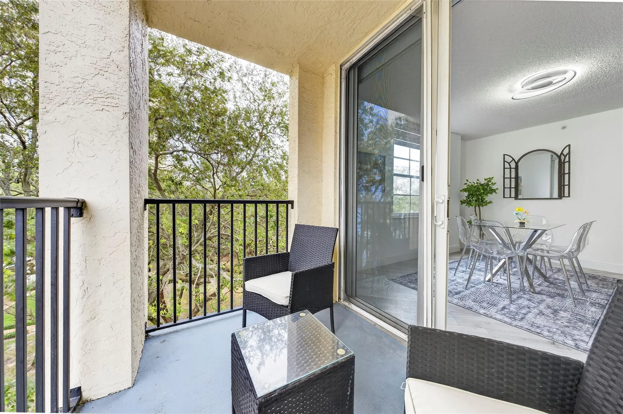 Private primary patio offers a peaceful retreat with leafy treetop views—perfect for morning coffee or unwinding in the evening.
