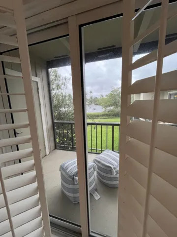 Beautiful wood shutters on sliders and bedroom window