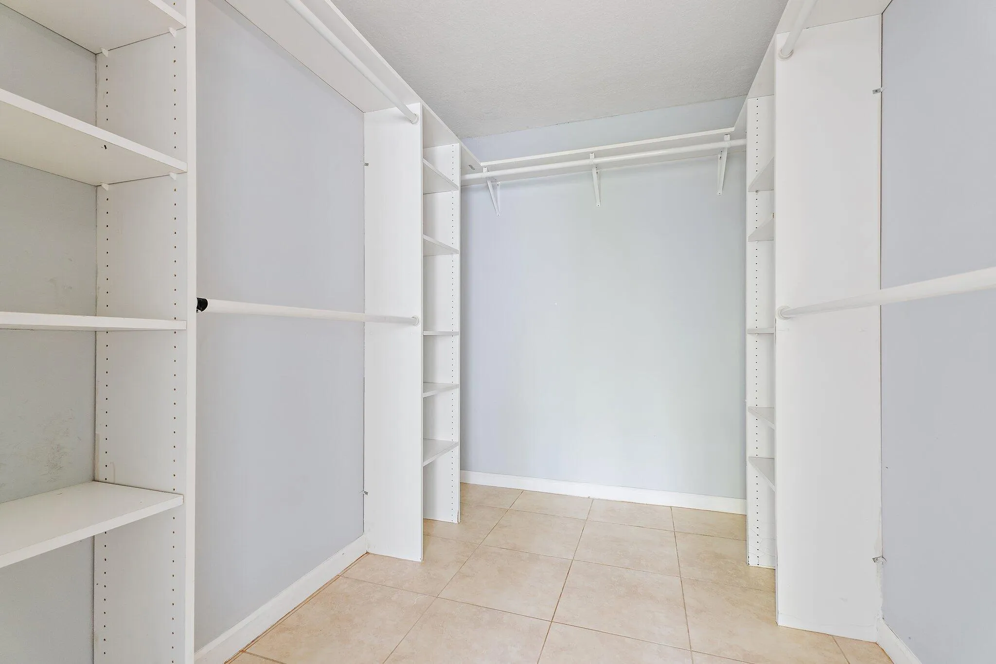 Walk in closet in primary bedroom