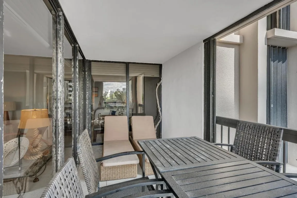 Balcony with sitting and dining areas