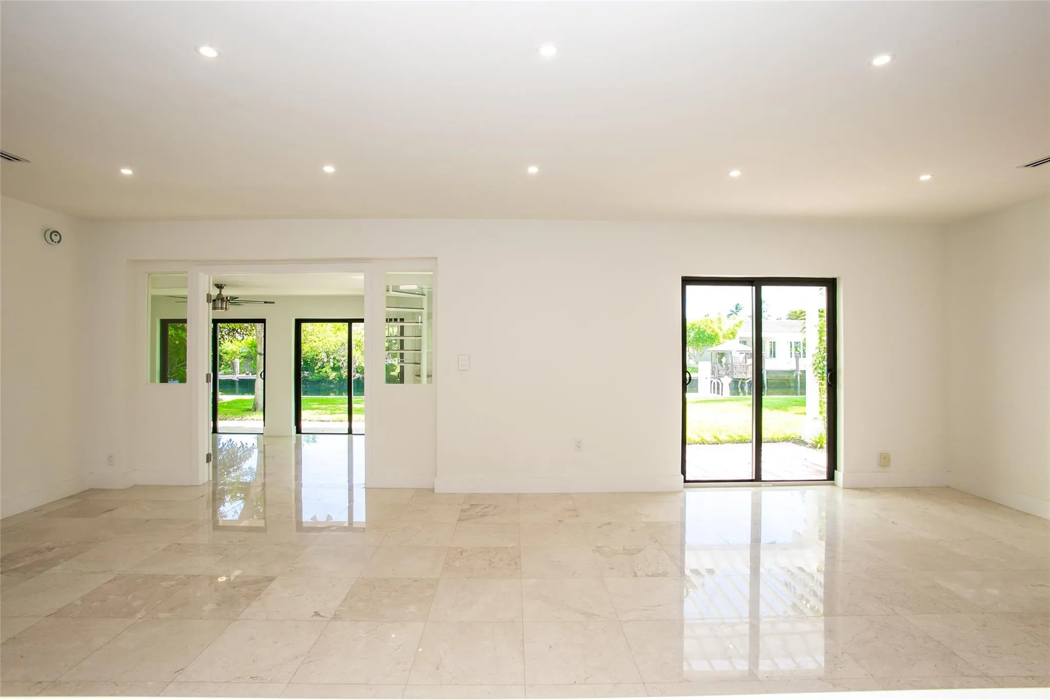 Living area with waterviews form every opening