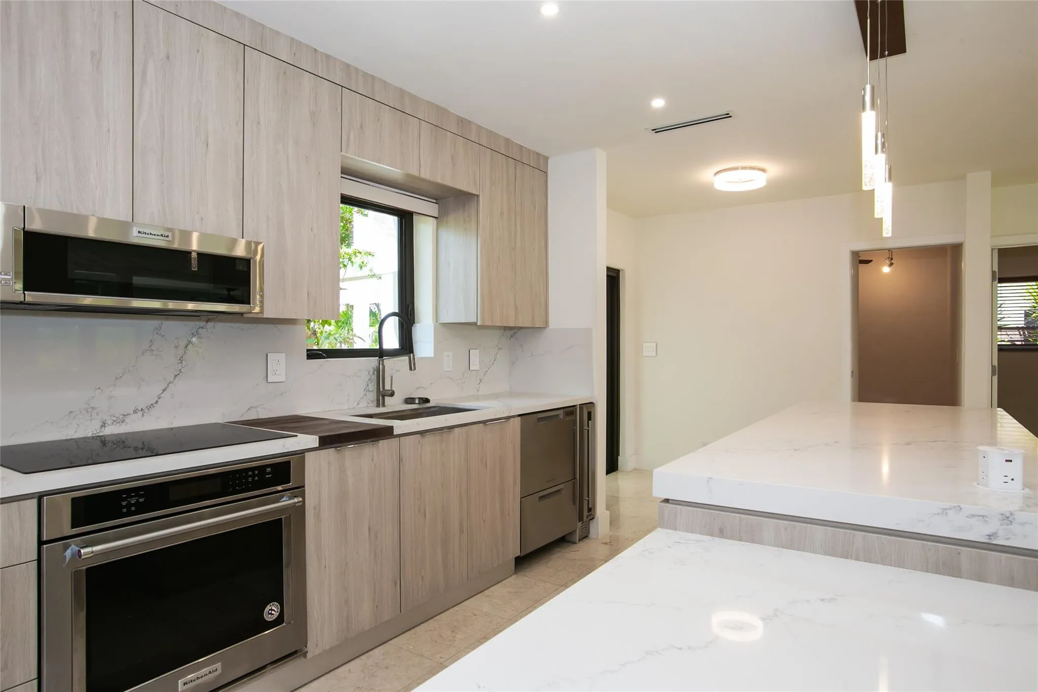 Stunning kitchen with elongated quartz island