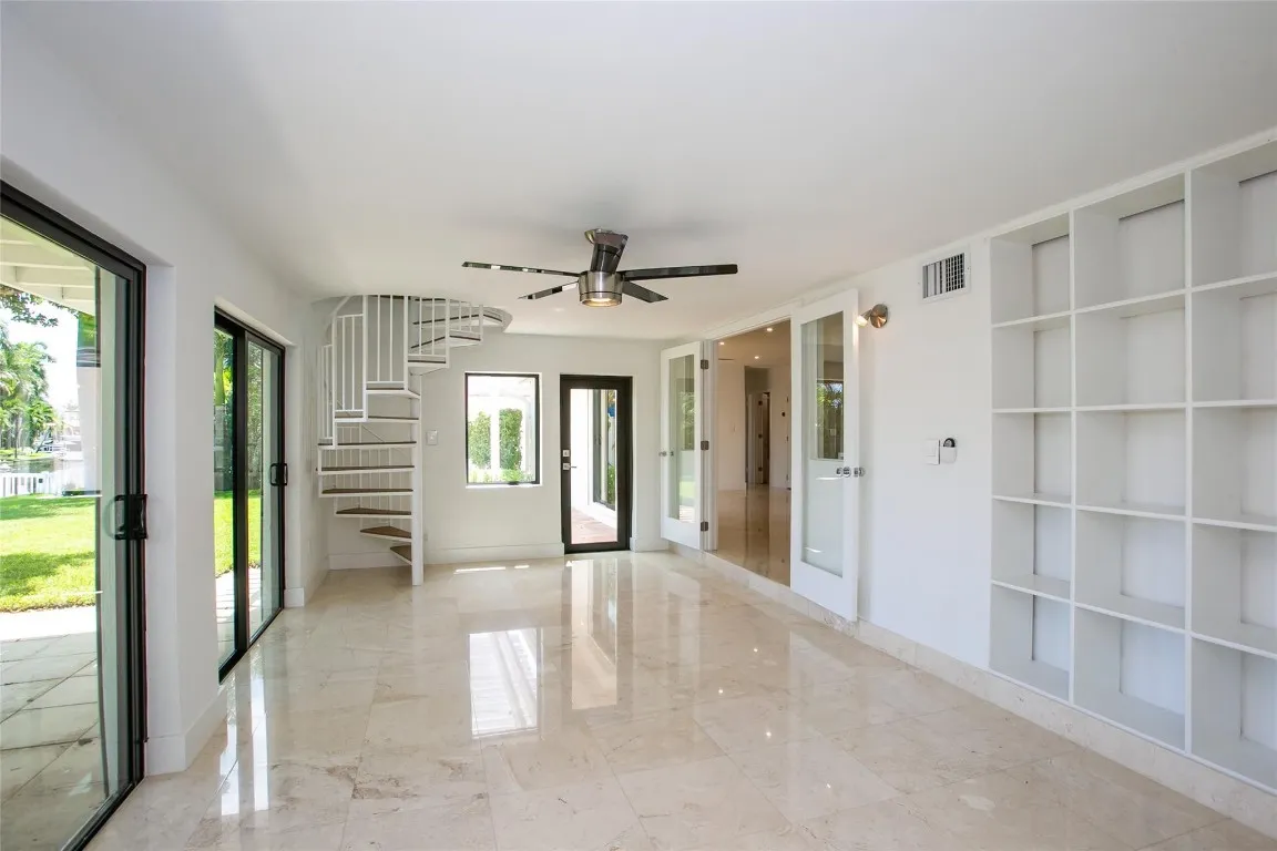 Florida room with spiral stair case