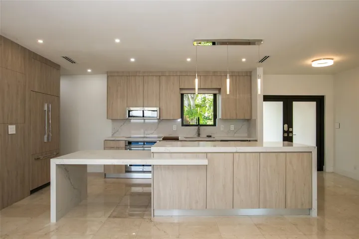Stunning kitchen with elongated quartz island