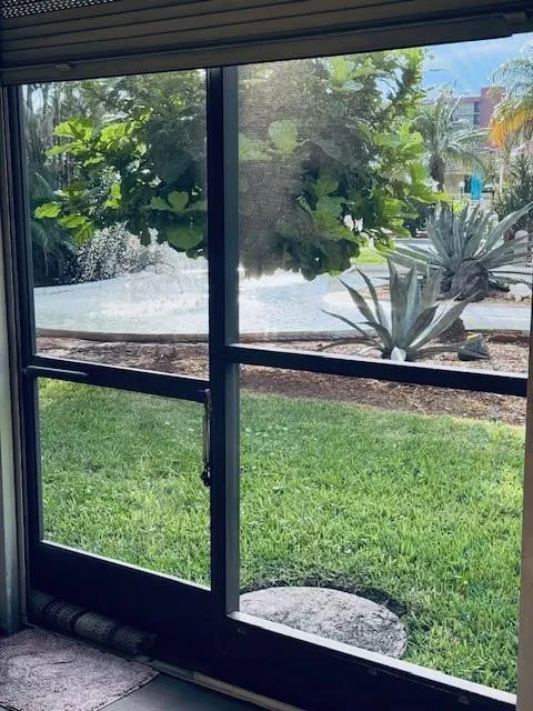 Well manicured courtyard with fountain and large heated pool.