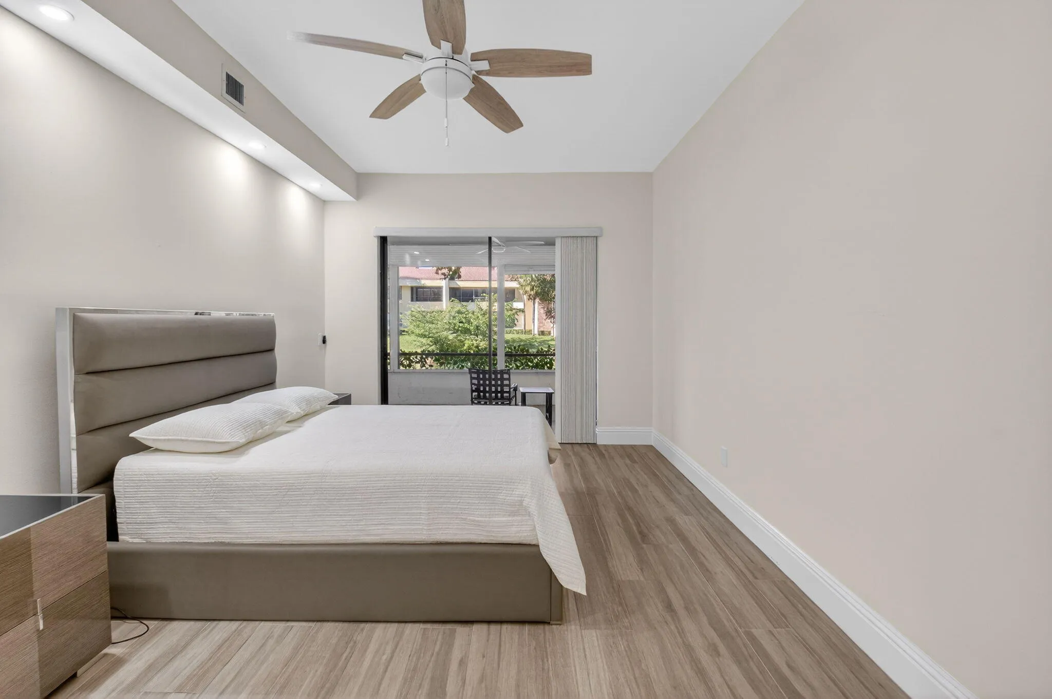 PRIMARY BEDROOM WITH SLIDER TO PATIO