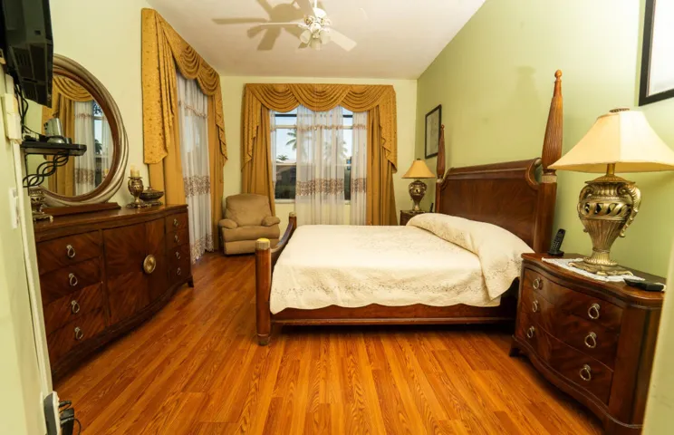 Comfortable primary bedroom with direct access to the backyard