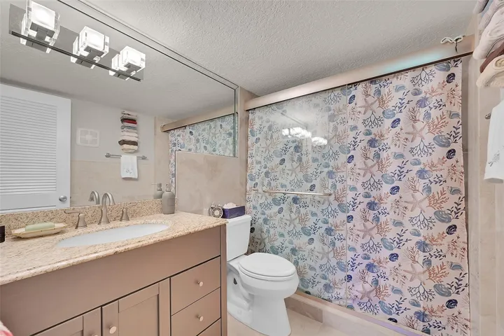 Updated primary bath with step in shower and custom oversized doors...
