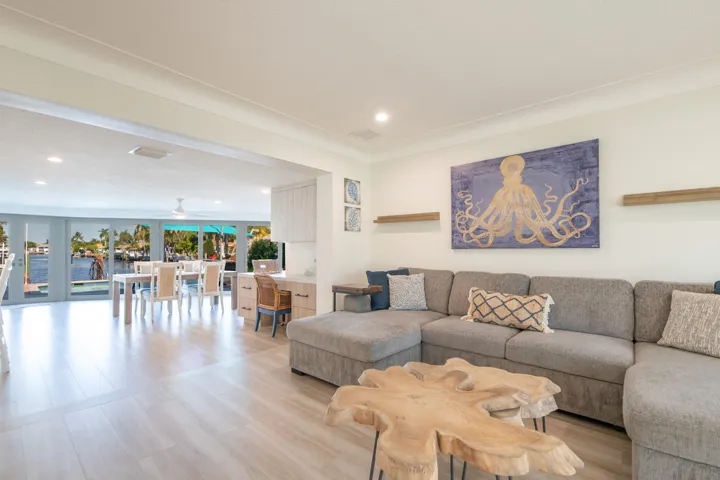 When entering you can see all the way through the living room to the water. Full renovated bed and bath behind the sofa.