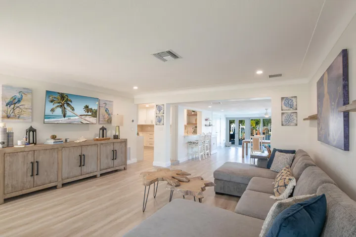 When entering you can see all the way through the living room to the water. Full renovated bathroom behind the sofa.