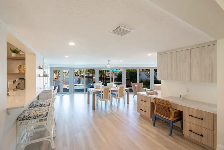 Gorgeous water views through wall to ceiling storm windows and electric blinds to close for privacy. New built in wrap around cabinetry for storage and space savings.