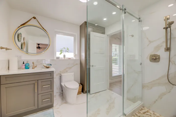 New and beautifully designed full bath. Gorgeous and elegant tiling, lighting and vanity