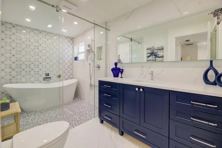Gorgeous deep blue new vanity and various tiles. Must see!!