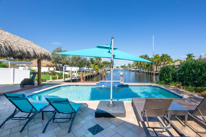 Unobstructed water views from this beautiful pool area with lots of room for tables or chairs.
