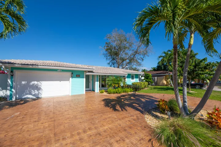 Large circular driveway and concrete siding.