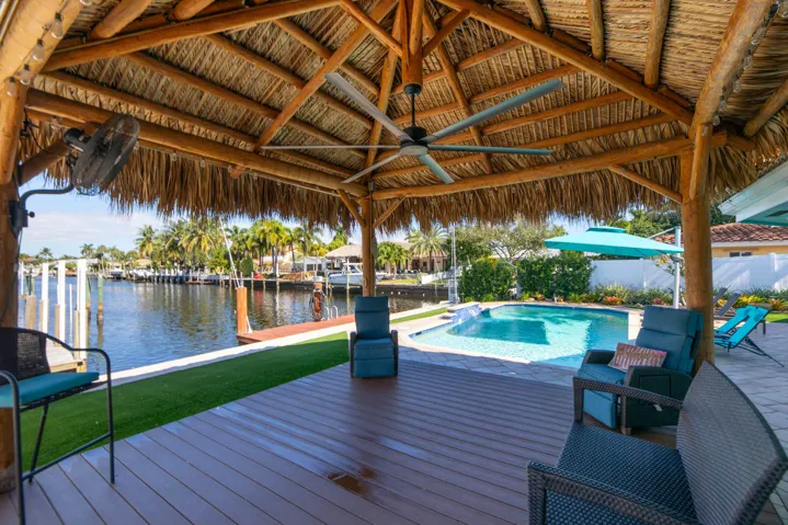 Large tiki hut with fans and additional electric.
