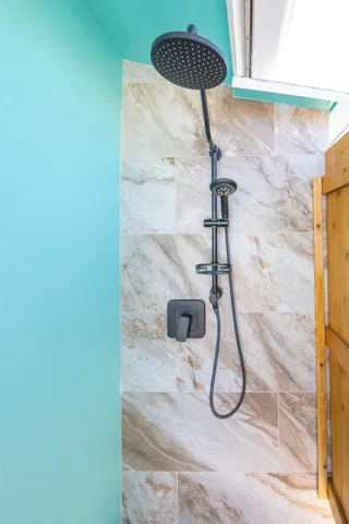 Outdoor shower by tiki hut