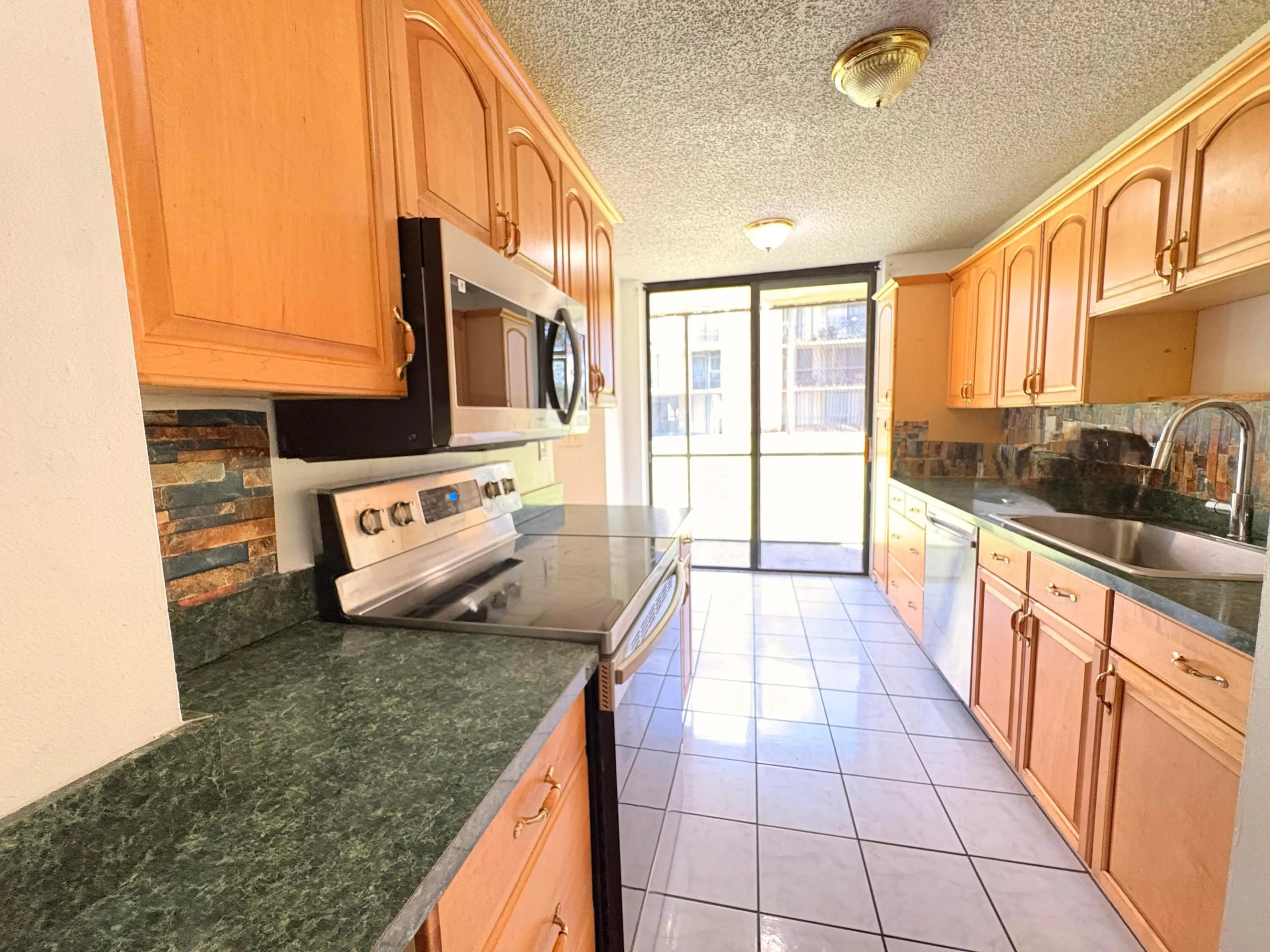 KITCHEN WITH PLENT OF CABINETS W/OVERSIZED WALK IN​​‌​​​​‌​​‌‌​‌‌​​​‌‌​‌​‌​‌​​​‌​​ PANTRY