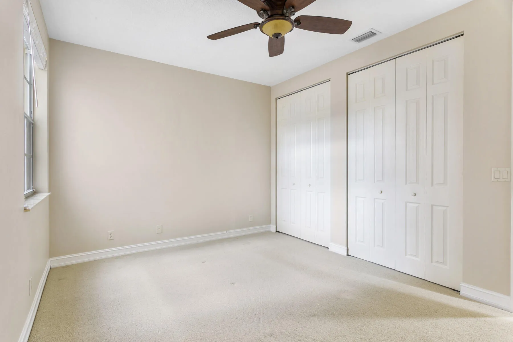 Two closets in the guest bedroom