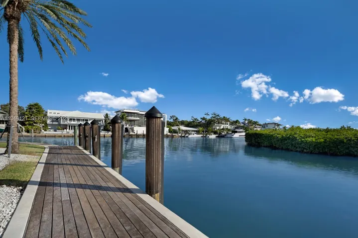 Dock access is easy from the bay. 100 foot boat can be accommodated. IPE Brazilian hardwood completes the super clean look.