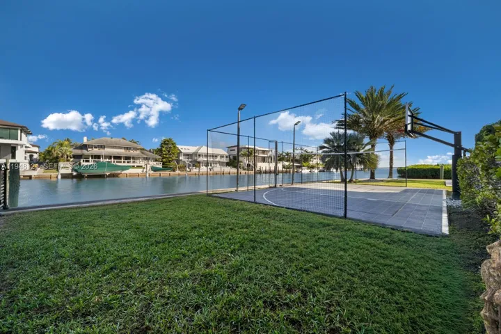 Waterfront sports court. Designed to be either volleyball or basketball court. Night lights and special surface makes this perfect for the Winter months when the days get shorter.