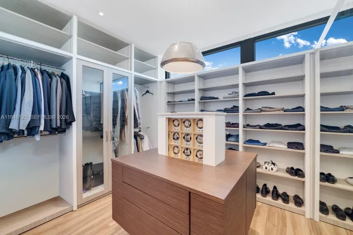 Hidden watch storage with winders by Studio Becker.