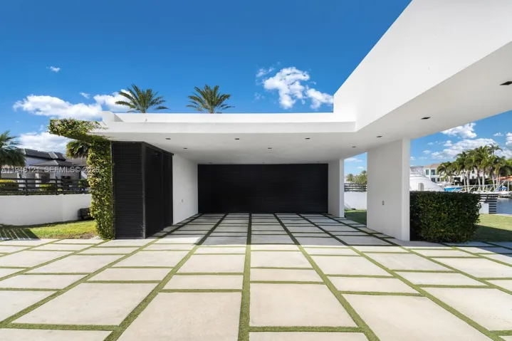 The driveway has a multi car carport for additional shaded parking