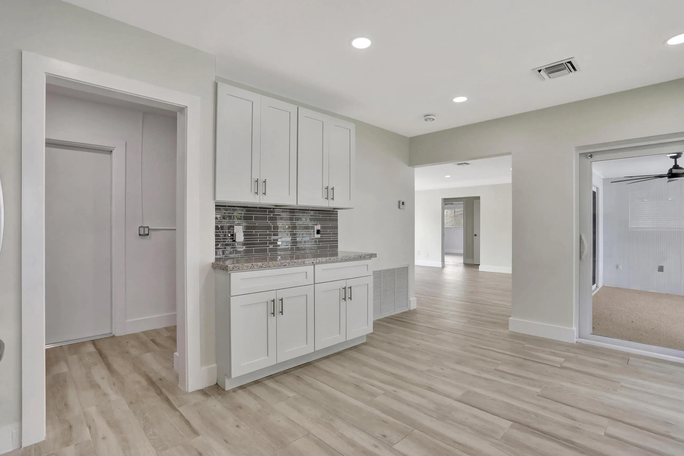 Extended part to kitchen. Door on left leads to laundry & utility room and garage.