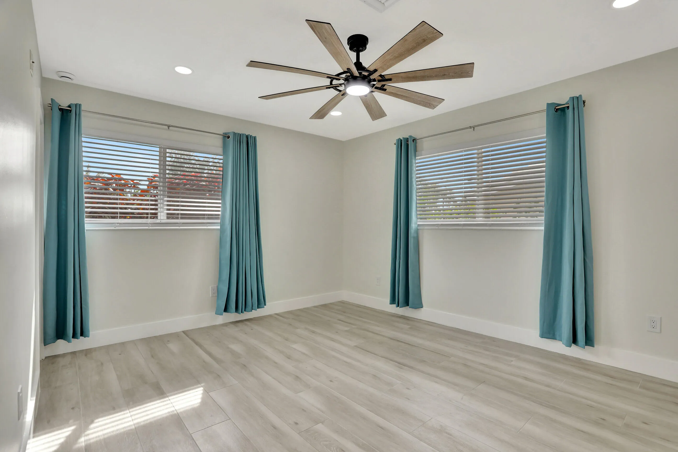 Bedroom 2 but can be primary suite. Has a full bathroom inside, storm windows and new large light and fan. High hat lighting.