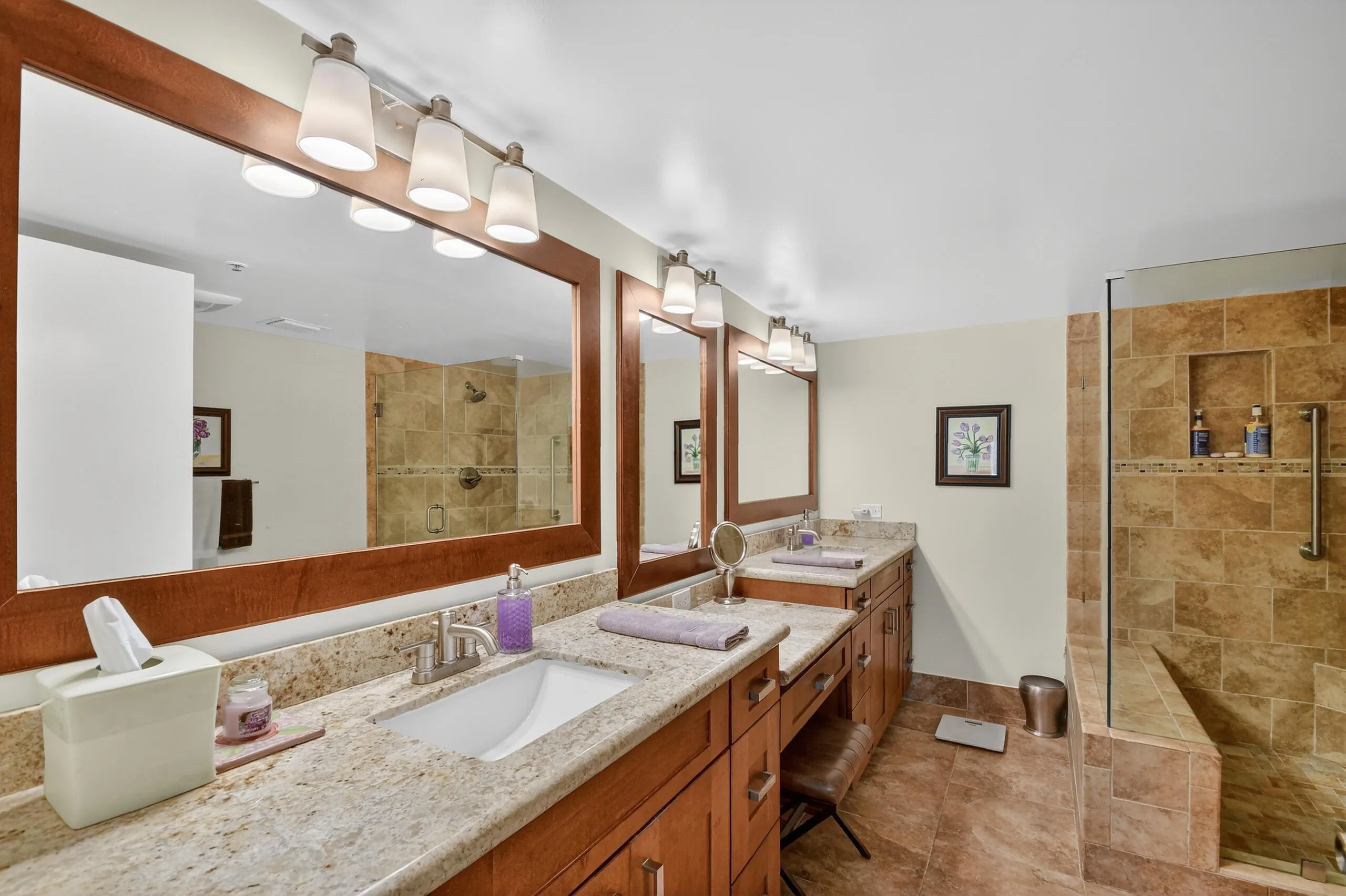 Updated primary bathroom with dual sinks and walk in shower.