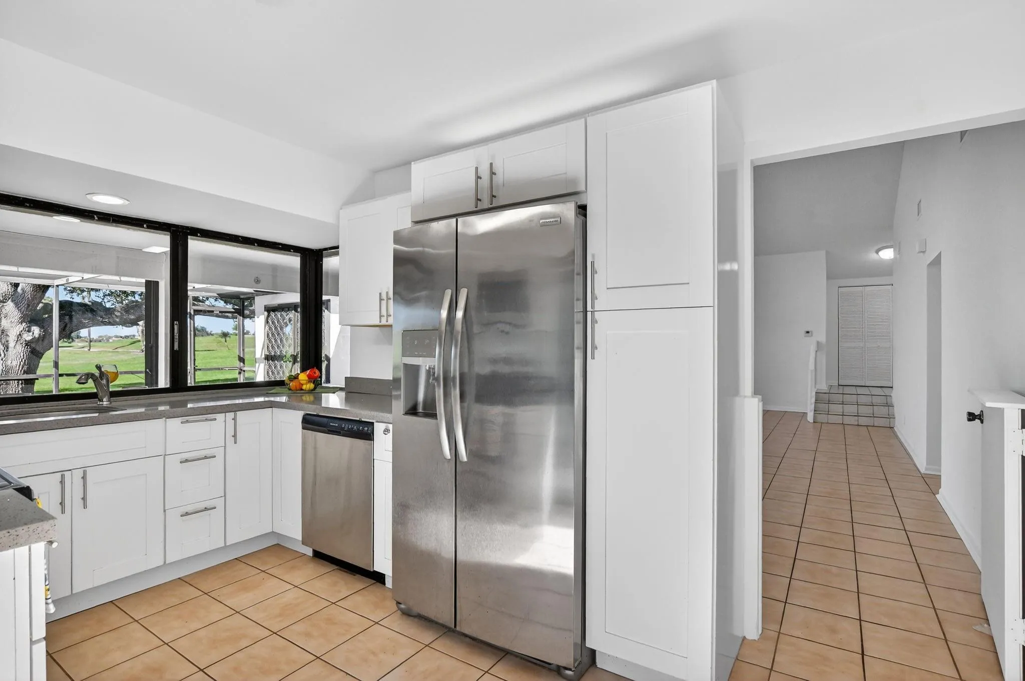 Stainless steel appliances and quartz countertops.