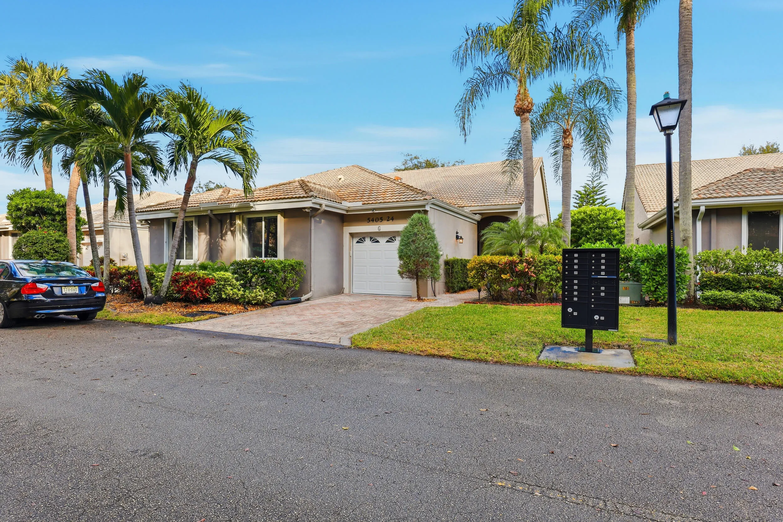 Charming villa with lush tropical landscaping and a welcoming approach. The paver driveway, one car garage, and private entry create great curb appeal while reflecting the relaxed South Florida lifestyle in this beautifully maintained community.